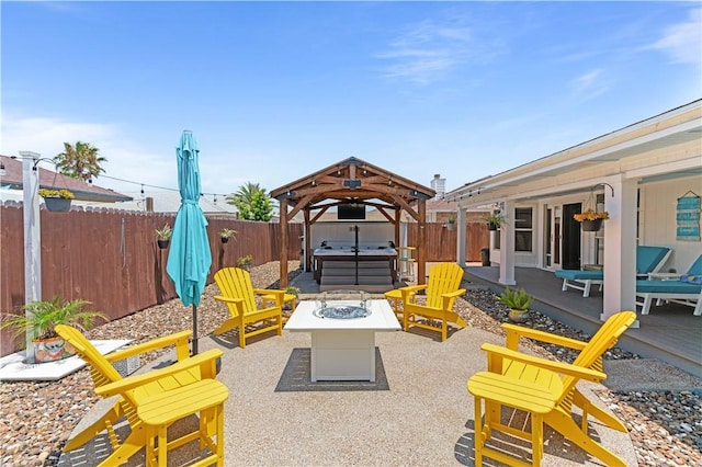15209 Dasmarinas Dr, Corpus Christi, TX 78418 - fenced backyard with a hot tub, an outdoor fire pit, and a patio