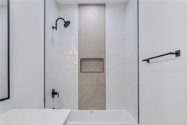 bathroom with tiled shower