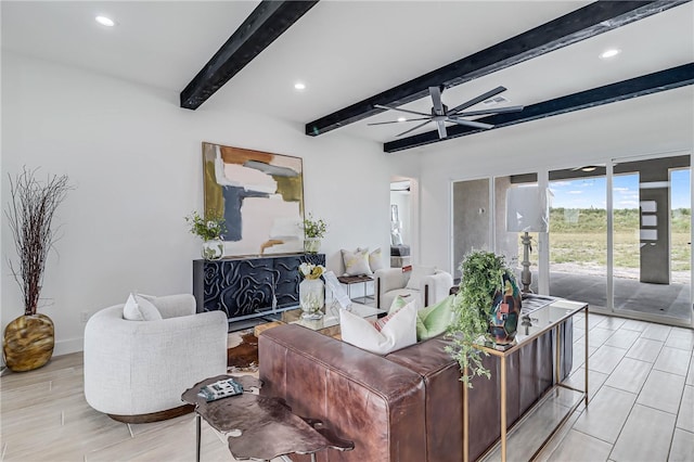 living room with light hardwood / wood-style floors, beamed ceiling, and ceiling fan