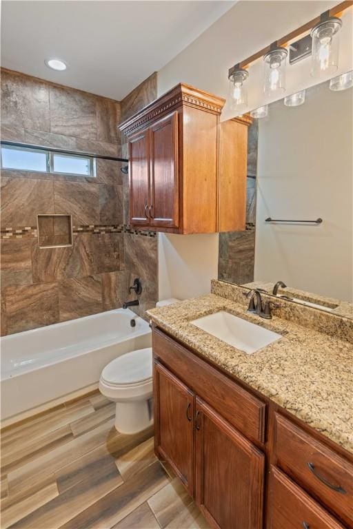 6913 Mets Ct, Corpus Christi, TX 78414 - bathroom featuring toilet,  shower combination, vanity, and wood finished floors