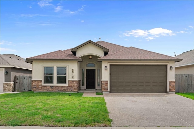 6913 Mets Ct, Corpus Christi, TX 78414 - view of front of property featuring stucco siding, an attached garage, concrete driveway, stone siding, and roof with shingles