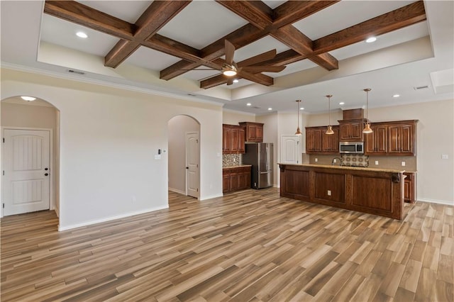 6913 Mets Ct, Corpus Christi, TX 78414 - unfurnished living room featuring arched walkways, coffered ceiling, a ceiling fan, recessed lighting, and beamed ceiling
