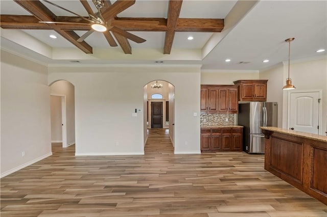 6913 Mets Ct, Corpus Christi, TX 78414 - unfurnished living room featuring arched walkways, a ceiling fan, coffered ceiling, recessed lighting, and baseboards