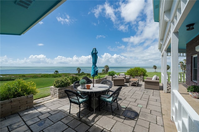 view of patio featuring outdoor lounge area and a water view