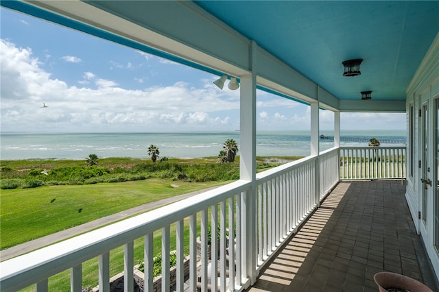 balcony featuring a water view