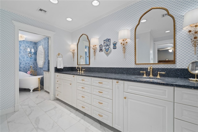 bathroom featuring tasteful backsplash, crown molding, vanity, a tub, and ceiling fan