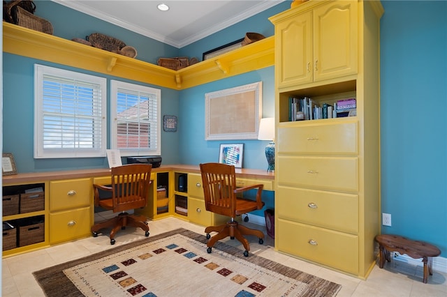 office area with light tile patterned floors, built in desk, and ornamental molding