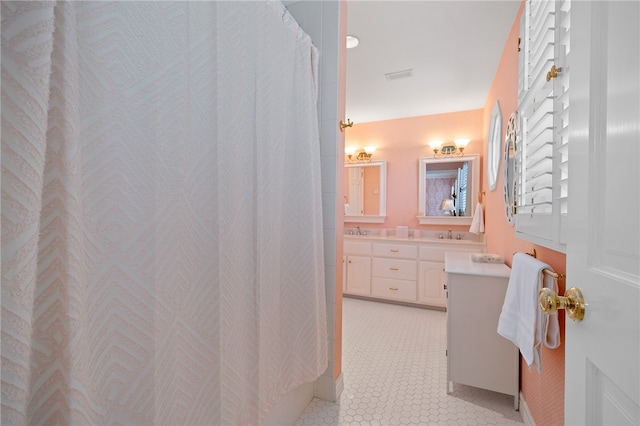 bathroom with vanity and a shower with shower curtain