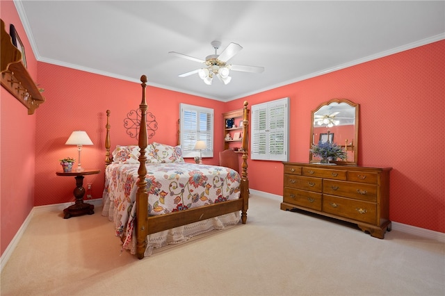 carpeted bedroom with ceiling fan and crown molding