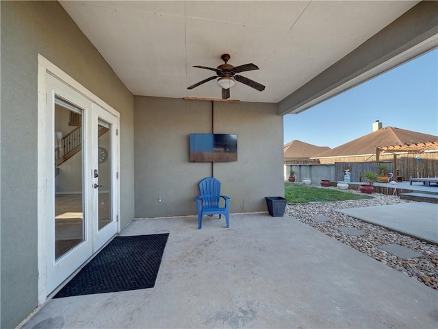 view of patio featuring ceiling fan and french doors