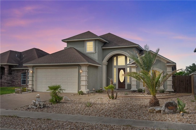 6738 Central Park, Corpus Christi, TX 78414 - view of front of house with driveway, an attached garage, stucco siding, and roof with shingles