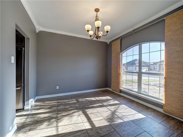 empty room with tile patterned flooring, ornamental molding, and a notable chandelier