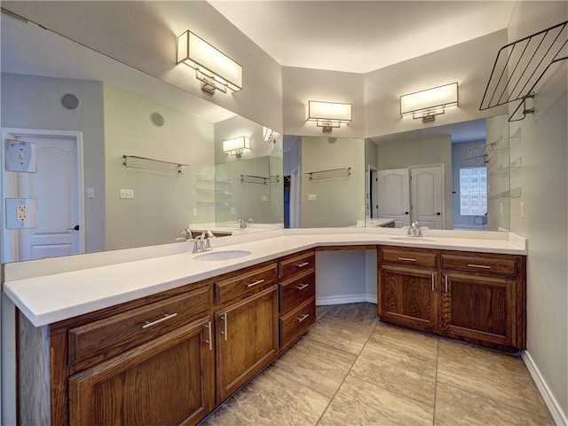 bathroom with tile patterned floors and vanity