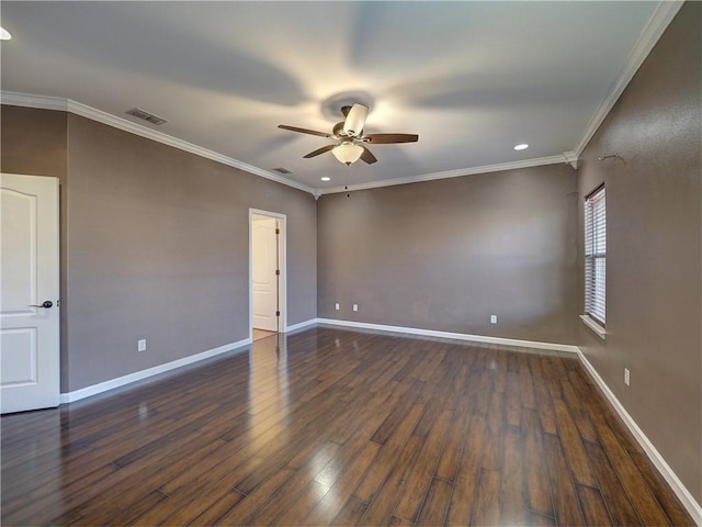 empty room with ceiling fan, dark hardwood / wood-style flooring, and ornamental molding