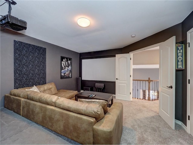 home theater room with light colored carpet