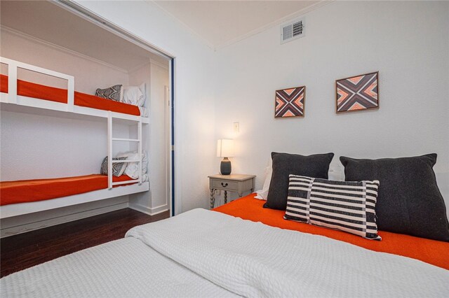 3938 Surfside Blvd Unit 3116, Corpus Christi, TX 78402 - bedroom with ornamental molding and wood finished floors