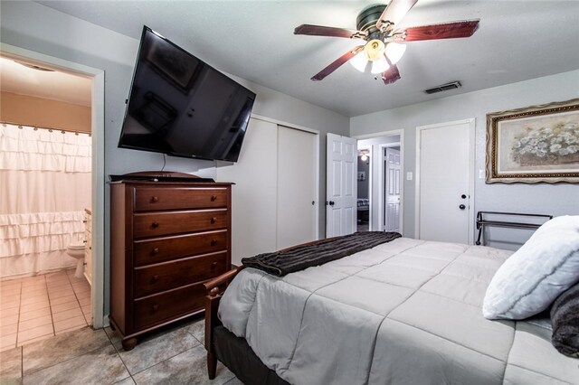 4009 Rooney Dr, Corpus Christi, TX 78413 - tiled bedroom with ensuite bathroom and ceiling fan