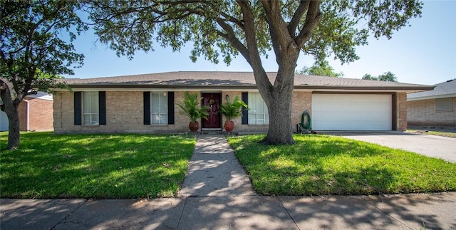 4009 Rooney Dr, Corpus Christi, TX 78413 - ranch-style home with brick siding, a garage, driveway, and a front yard