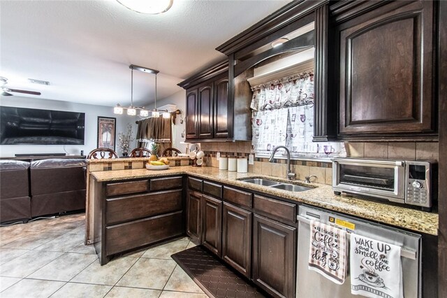 4009 Rooney Dr, Corpus Christi, TX 78413 - kitchen with dishwasher, a sink, open floor plan, a peninsula, and light tile patterned floors