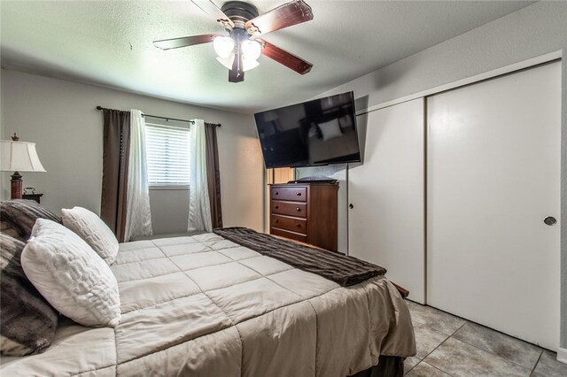 4009 Rooney Dr, Corpus Christi, TX 78413 - bedroom with a closet, ceiling fan, and light tile patterned floors
