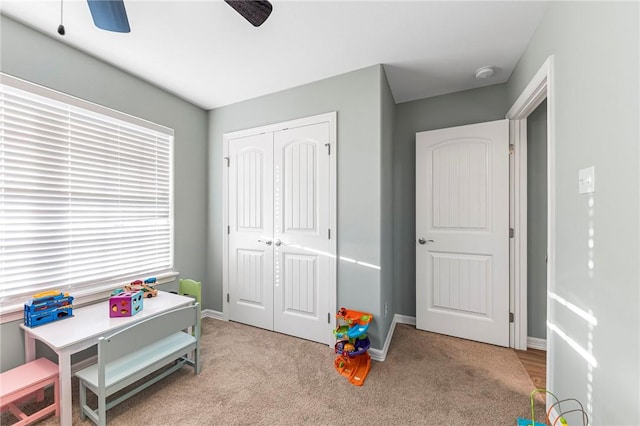 playroom featuring baseboards and carpet floors