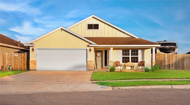 view of front facade featuring fence, roof with shingles, concrete driveway, a garage, and board and batten siding