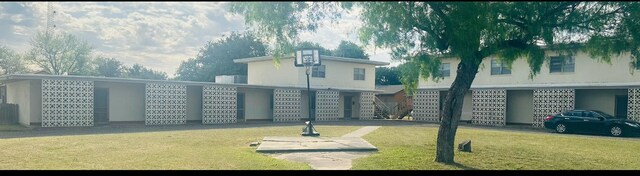 view of home's community with a yard