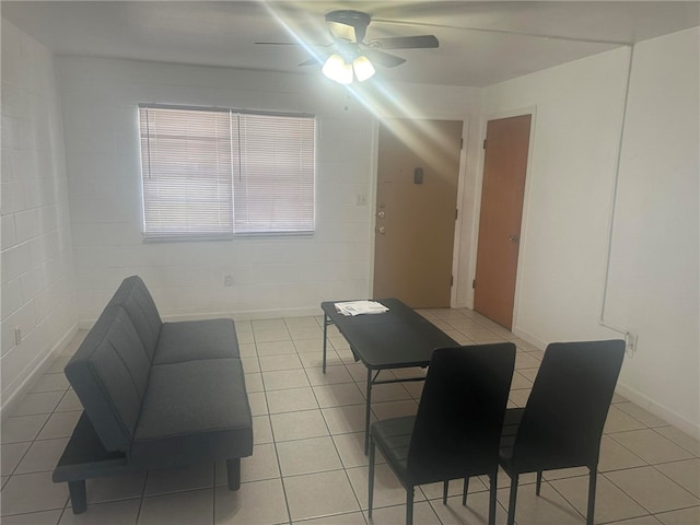 tiled living room with ceiling fan