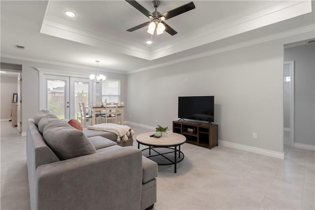 1501 Days End Dr, Corpus Christi, TX 78417 - living area featuring a chandelier, a tray ceiling, ceiling fan, crown molding, and light tile patterned floors