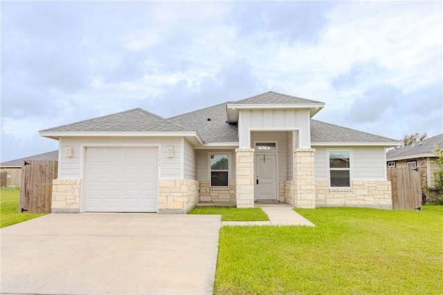 1501 Days End Dr, Corpus Christi, TX 78417 - prairie-style home featuring a shingled roof, a garage, driveway, stone siding, and board and batten siding