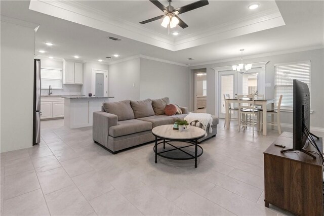1501 Days End Dr, Corpus Christi, TX 78417 - living room featuring a tray ceiling, ceiling fan, healthy amount of natural light, light tile patterned flooring, and recessed lighting