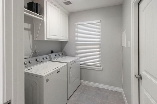 1501 Days End Dr, Corpus Christi, TX 78417 - laundry area with washing machine and dryer, cabinet space, and light tile patterned floors