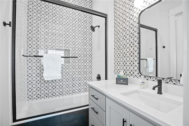 bathroom featuring an enclosed shower and vanity