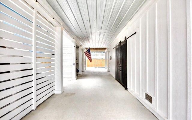 1227 S Magnolia St, Rockport, TX 78382 - hallway featuring concrete flooring and visible vents