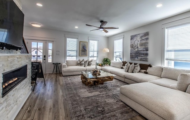 1227 S Magnolia St, Rockport, TX 78382 - living area with recessed lighting, a fireplace, wood finished floors, and ceiling fan