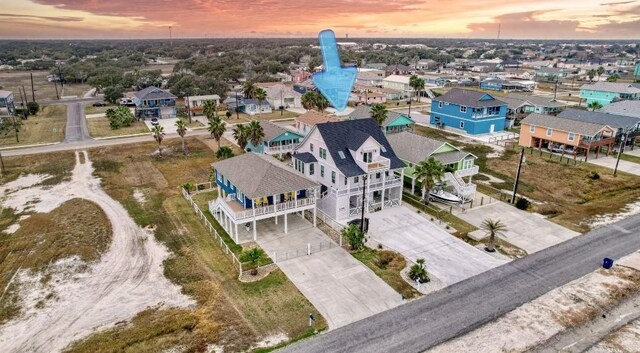 1227 S Magnolia St, Rockport, TX 78382 - aerial view at dusk featuring a residential view