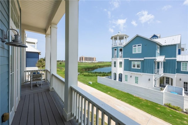 balcony featuring a water view