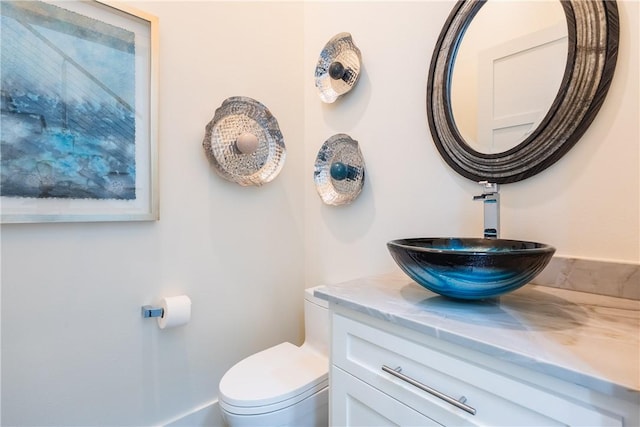 bathroom with vanity and toilet