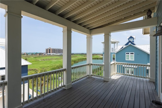 wooden terrace with a water view