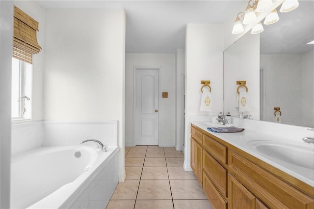 15426 Cuttysark St, Corpus Christi, TX 78418 - full bath with double vanity, a garden tub, and tile patterned flooring
