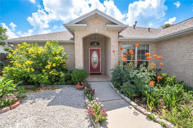 15426 Cuttysark St, Corpus Christi, TX 78418 - property entrance with brick siding and a shingled roof
