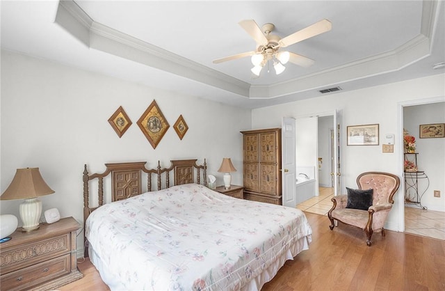 15426 Cuttysark St, Corpus Christi, TX 78418 - bedroom with a raised ceiling, crown molding, light wood-style floors, and ceiling fan
