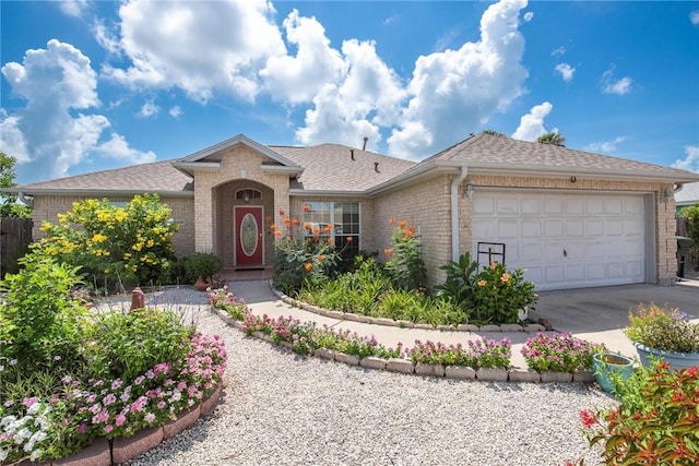 15426 Cuttysark St, Corpus Christi, TX 78418 - ranch-style house featuring brick siding, an attached garage, driveway, and roof with shingles