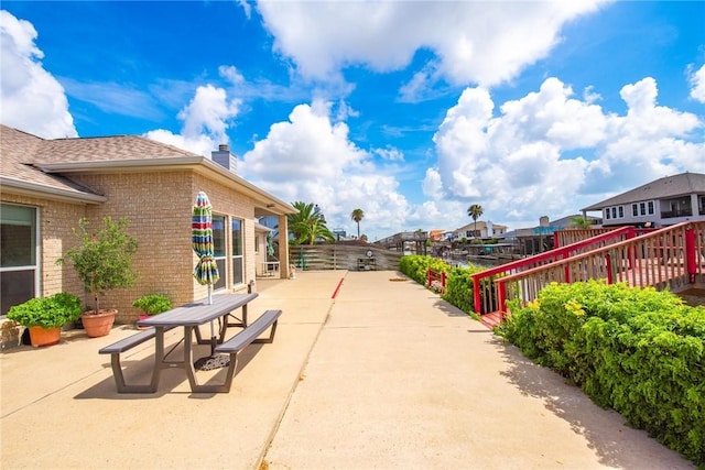 15426 Cuttysark St, Corpus Christi, TX 78418 - fenced backyard featuring a patio and outdoor dining area
