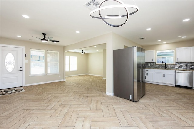 foyer featuring a ceiling fan, recessed lighting, and baseboards