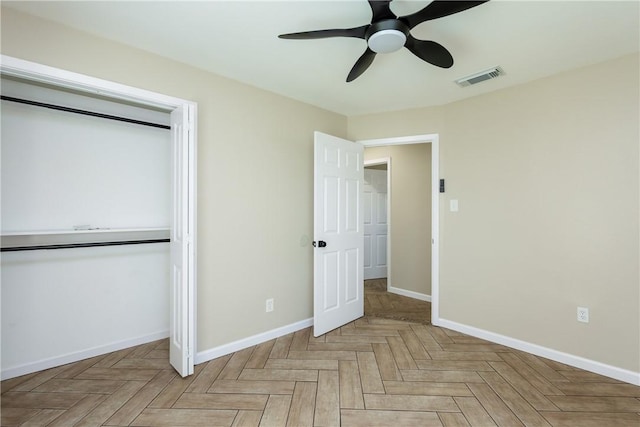 unfurnished bedroom featuring visible vents, baseboards, a closet, and ceiling fan