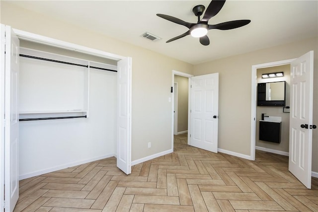 unfurnished bedroom featuring visible vents, baseboards, a closet, and ceiling fan