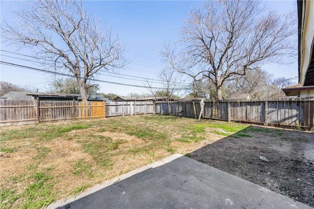 view of yard featuring a patio and a fenced backyard