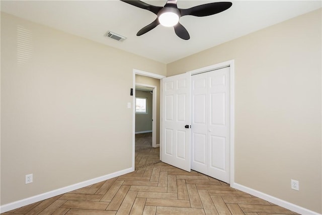 unfurnished bedroom with visible vents, baseboards, a closet, and ceiling fan