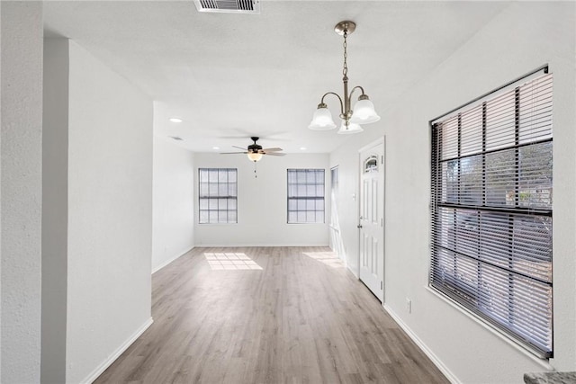 interior space featuring hardwood / wood-style floors and a notable chandelier